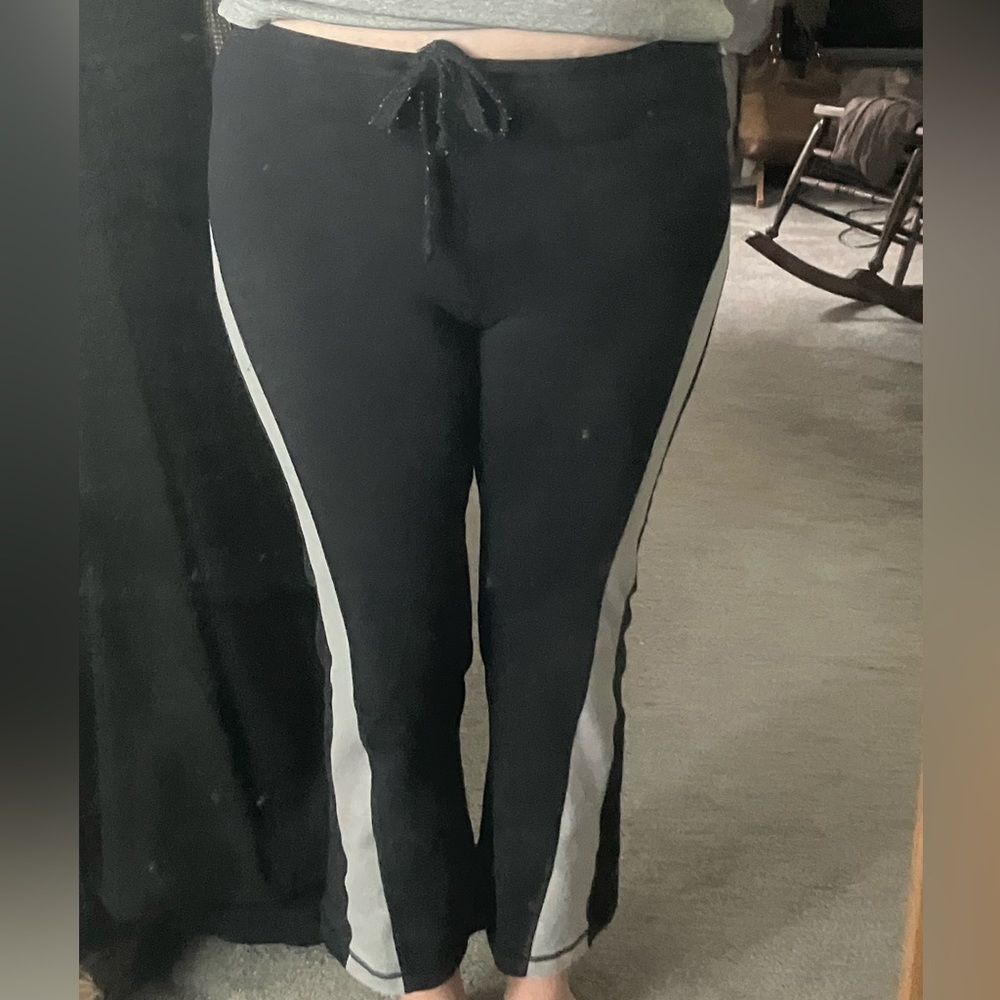 Lululemon Sz S. Black w/Lg broad gray band in shape of brand. Drawstring waist.